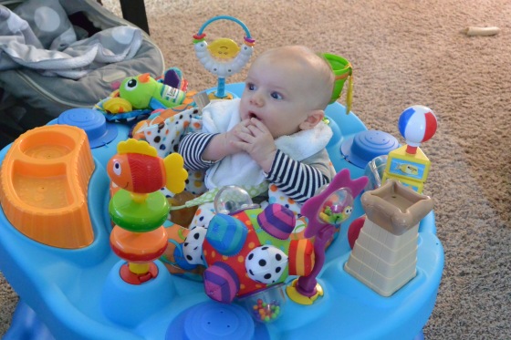 started using the exersaucer... even though his toes barely touch. He likes to sit up and see things. 